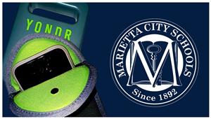  image of a cell phone in a cloth pouch with the marietta city schools seal next to it